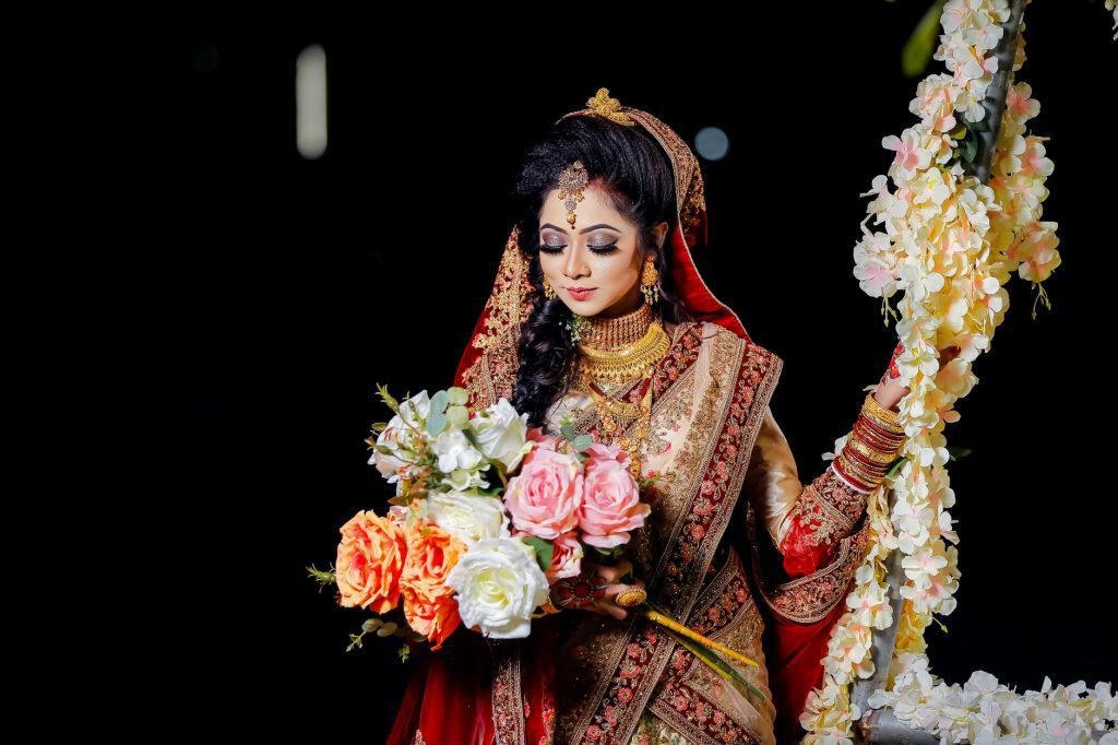 woman carrying bouquet of flowers
