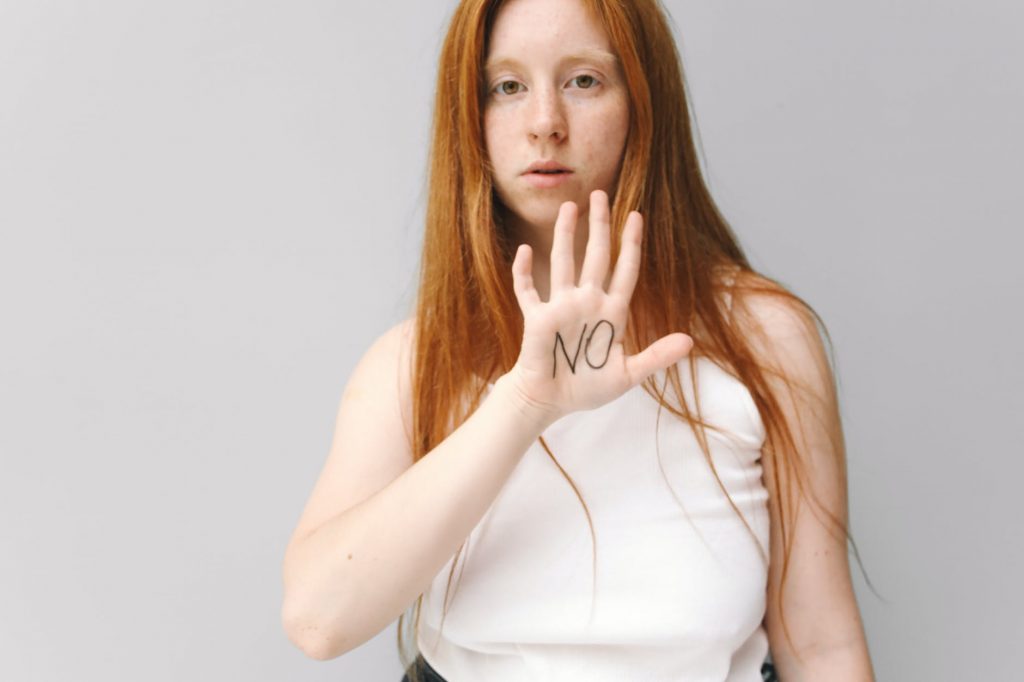 a woman saying no with hand gesture